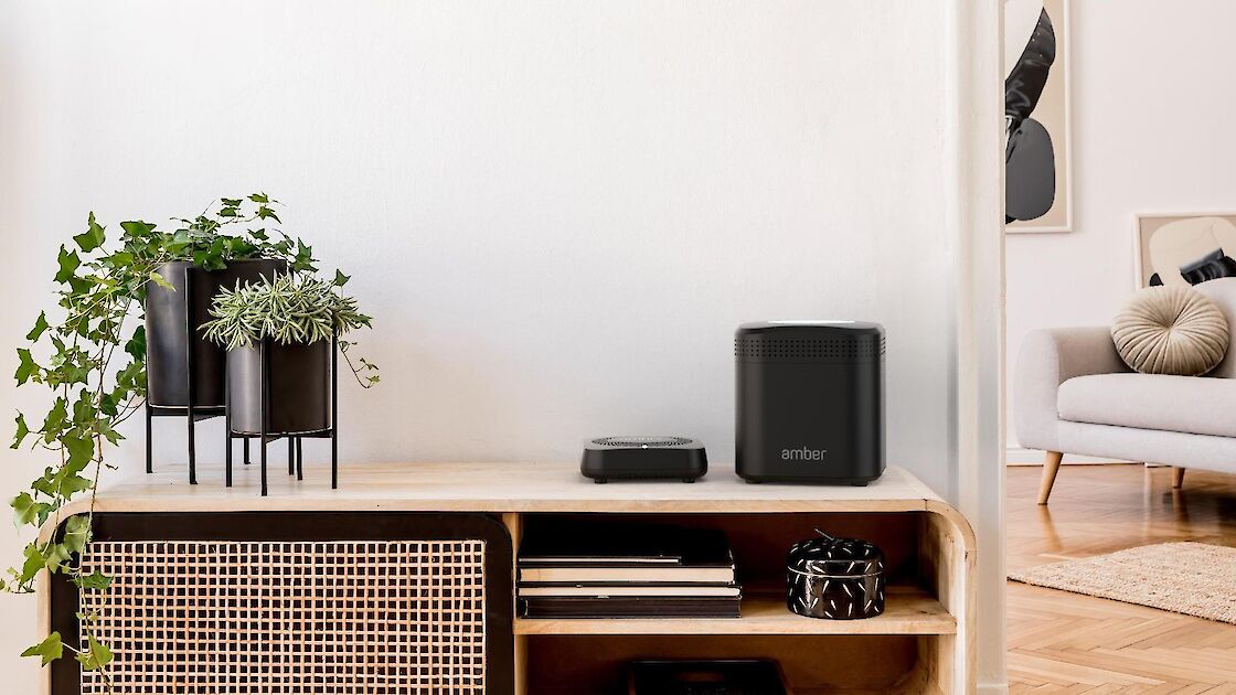 Amber devices sitting on shelf side-by-side.