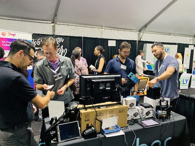 People interactive with team members at the Amber booth at the LA Small Business Expo