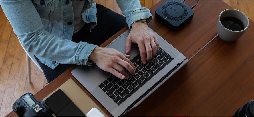 Person typing on a laptop keyboard