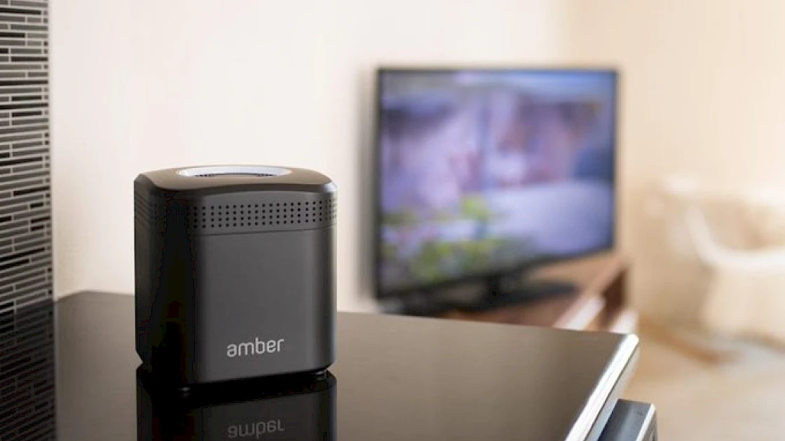 AmberPro on a shelf near the TV in a livingroom