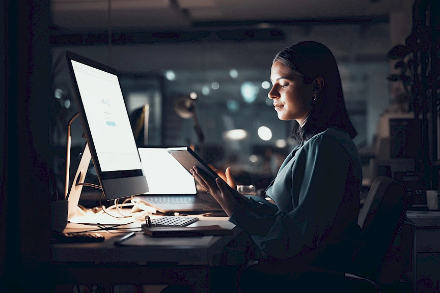 Woman at a computer with a VAISense login screen.